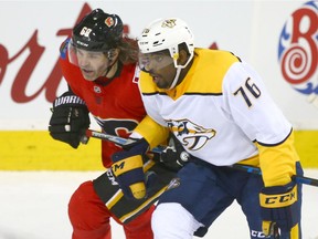 Flames Jaromir Jagr (L) and Predators P.K. Subban check each other closely during NHL action between the Nashville Predators and the Calgary Flames in Calgary Saturday, December 16, 2017.