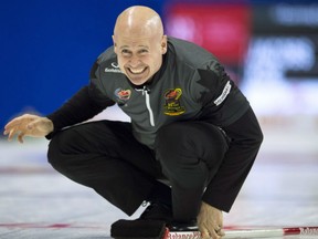 Skip Kevin Koe of Calgary tracks a shot during action at the Olympic Curling Trials Sunday in Ottawa. The Koe rink won a pair of games Sunday to improve to 3-0. Jennifer Jones of Winnipeg was also at 3-0 to lead the women's standings.