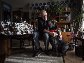 Hans Granholm pictured with his dog Parker in Edmonton, Alta., on Thursday December 7, 2017. Parker is not yet five years old and has been giving blood regularly for nearly three of them. "He just gave his 12th donation," said Hans Granholm of Edmonton. The rescue dog, which had to go through a series of tests to make sure he was eligible to donate, doesn't seem to mind the donor sessions at all.