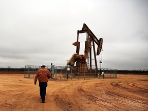 An oil well owned and operated by Apache Corporation in the Permian Basin are viewed on February 5, 2015 in Garden City, Texas.