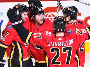 The Calgary Flames celebrate Sam Bennett's game-winning goal against the Vancouver Canucks late in the third period during NHL action in Calgary Saturday December 9, 2017.