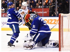 Toronto Maple Leafs goalie Frederik Andersen (31) makes a save as Maple Leafs defenceman Roman Polak (46) and Calgary Flames left wing Micheal Ferland (79) battle during third period NHL hockey action in Toronto on Wednesday, December 6, 2017.