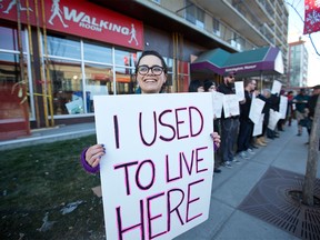 Residents and members of Renters Action Movement protest outside Kensington Manor in Calgary on Saturday, Dec. 16, 2017.