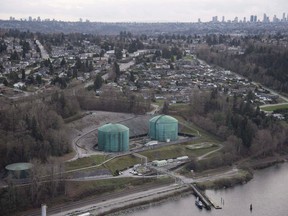 Kinder Morgan Trans Mountain Expansion Project's Westeridge loading dock, at centre with green tanks, is seen in Burnaby, B.C., on November 25, 2016. Kinder Morgan Canada says it is still not in a position to start significant construction on the Trans Mountain expansion project and expects spending on the project for at least part of next year to focus mostly on permitting. THE CANADIAN PRESS/Jonathan Hayward