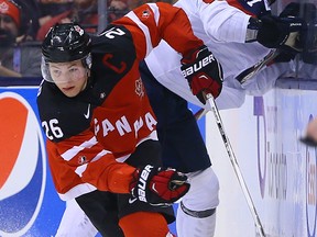 Curtis Lazar of Team Canada gets away from Michal Kabac of Team Slovakia during the semis of 2015 World Junior Hockey Championships at the Air Canada Centre in Toronto on Sunday January 4, 2015