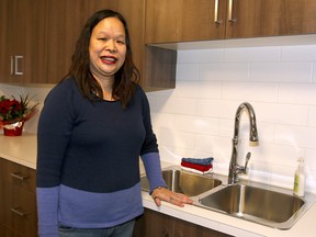 Adriana Chow poses for a photo at Journey House 2, a 10 unit, three-bedroom apartment building recently purchased and renovated by Calgaryís Family Emergency Shelter and housing provider, Inn from the Cold. Chow and her two sons will be one of the first families to move into Journey House 2. Tuesday, December 19, 2017. Dean Pilling/Postmedia