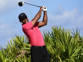 Tiger Woods tees off on the third hole during the final round of the Hero World Challenge golf tournament at Albany Golf Club in Nassau, Bahamas on Dec. 3, 2017.