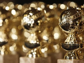 FILE - In this Jan.. 6, 2009, file photo, Golden Globe statuettes are displayed during a news conference in Beverly Hills, Calif. Nominations for the 75th annual Golden Globes will be announced on Monday, Dec. 11, 2017.