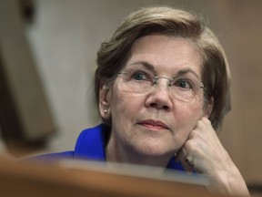 FILE- In this Dec. 5, 2017, file photo, Sen. Elizabeth Warren, D-Mass., waits to speak during a meeting of the Senate Banking Committee on Capitol Hill in Washington. Warren was the focus last year of a 22-page comic titled "Female Force: Elizabeth Warren" and now the publisher TidalWave Comics is bringing out a sequel, "Female Force: Elizabeth Warren #2."