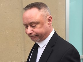 Const. Robert Cumming leaves court after his acquittal on three criminal charges.