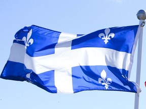 Canadian Flag and Quebec Flag are seen over looking the Ottawa River from the Civilization Museum behind Parliament Hill in Gatineau Sept 19, 2012.   (ANDRE FORGET/QMI AGENCY)