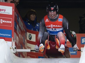 The Canadian team of Tristan Walker (front) and Justin Snith push their sled at the start of the doubles race during the Viessmann Luge World Cup in 2014. This year's event goes on the weekend.