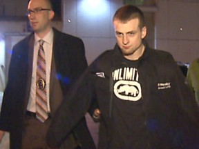 January 19, 2013 - Walker Risling at the Arrest Processing Unit with two Major Crimes Detectives on Jan. 18, 2013. He was charged with second degree murder in the stabbing death of Matthew Brown, Jan. 5, 2013 in Taradale. Courtesy CBC.