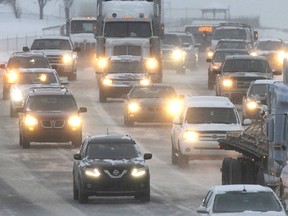 Traffic crawls through blowing snow on Deerfoot Trail.