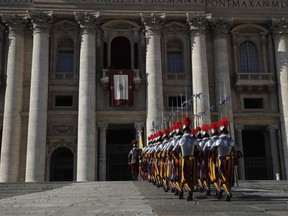 Vatican Swiss guards march toward the St. Peter's Basilica prior to the start of Pope Francis' Urbi et Orbi (Latin for 'to the city and to the world') Christmas' day blessing at the Vatican, Monday, Dec. 25, 2017.