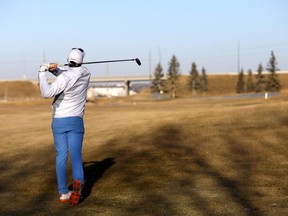 Golfers were taking advantage of the warm December weather golfing at Fox Hollow Golf course which plans to stay open until the snow blows in Calgary on Sunday December 10, 2017. Darren Makowichuk/Postmedia