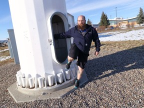 Instructor Chris DeLifle, exits the training tower used by the Lethbridge College Wind Turbine Technician program.