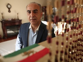 Eghbal Kayadan, editor of a local Farsi magazine poses for a photo at his home in Calgary, on Wednesday January 3, 2018. Leah Hennel/Postmedia