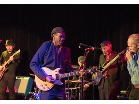 Charlie Butler, in front on guitar, leads his band, Charlie B and the Groove Crew.