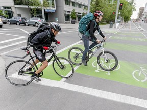 Cyclists ride the 12th Avenue track in Calgary.