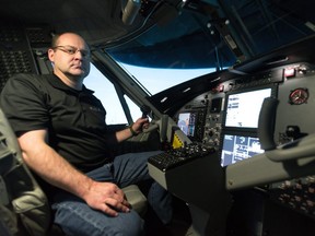 Pacific Sky Aviation flight instructor Kelly Chennells inside the company's new de Havilland Canada DHC-6 Twin Otter flight simulator in Calgary, Alta. on Friday, Jan. 5 2018. Transport Canada's "type D" certification of the unit this week makes it the only such Twin Otter simulator in the world where flight time inside the simulator counts the same as real-world flight hours. Bryan Passifiume/Postmedia Network