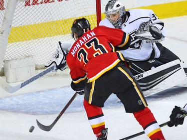 Calgary Flames forward Sean Monahan fires the puck past Los Angeles Kings goaltender Darcy Kuemper to score in the first period during NHL action in Calgary on Wednesday January 24, 2018.