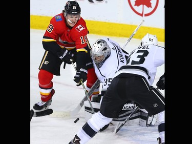 Calgary Flames forward Matthew Tkachuk reaches for a rebound in front of Los Angeles Kings goaltender Darcy Kuemper during NHL action in Calgary on Wednesday January 24, 2018.