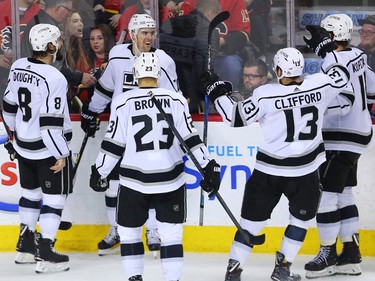 The Los Angeles Kings' celebrate scoring in overtime to defeat the Calgary Flames 2-1 in NHL action in Calgary on Wednesday January 24, 2018.