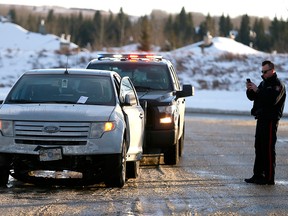 Calgary police arrest a suspect after he allegedly carjacked a vehicle in a N.E. Calgary parking lot, hitting multiply people and eventually being arrested outside of Calgary off of Highway 8 west of the city on Saturday January 6, 2018.