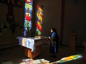 Sister Aloysia Safranowiz, 104, prays in the chapel at the Sisters Servants of Mary Immaculate convent in Mundare, Alta.