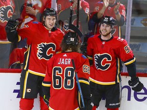 Flames Mark Jankowski (L) celebrates his second goal of the night with teammates Sam Bennett and Jaromir Jagr during NHL action between the Arizona Coyotes and and the Calgary Flames in Calgary on Thursday, November 30, 2017. Flames won 3-0. Jim Wells/Postmedia