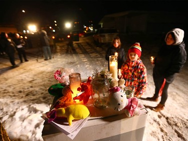 Supporters gather during a candlelight vigil in northwest Calgary on Wednesday, January 3, 2018 for the baby found dead on Christmas Eve. Abouth 100 or more Calgarians and made respects for the newborn. Police and still looking for the mother and any other clues in the case. Jim Wells/Postmedia