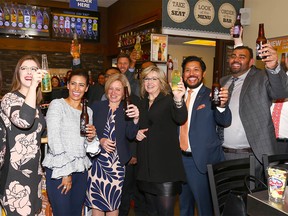 Alberta Premier Rachel Notley (3rd from left ) joins Ravinder Minhas (far right), co-founder and CEO, Minhas Breweries & Distillery, Manjit MInhas (2nd left), co-founder of Minhas Breweries, Distillery and Winery and Ricardo Miranda (2nd right), Alberta Minister of Culture and Tourism (L-R) in Calgary during a tour of Minhas Micro Brewery on Thursday, January 18, 2018. Jim Wells/Postmedia