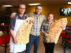 (L-R) Salah Shamami, Saman Shamami and Fozieh Shamami with homemade Kurdish bread at Saman Restaurant on 17th Avenue S.E. in Calgary. The traditional Iranian/ Kurdish bread is made by hand in an oven brought from Iran and the family make upwards of 300 - 400 a day depending on demand.