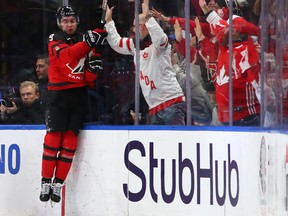 Dillon Dube celebrates his goal against Sweden in the second period during the gold medal game on Jan. 5, 2018