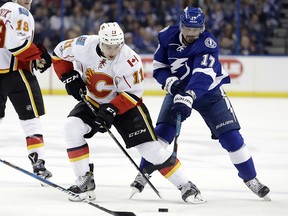 Calgary Flames Mikael Backlund battles with Tampa Bay Lightning forward Alex Killorn on Feb. 23, 2017, in Tampa.