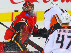 Calgary Flames goaltender Mike Smith with a save against the Anaheim Ducks during NHL hockey at the Scotiabank Saddledome in Calgary on Saturday, January 6, 2018.