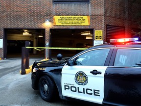 Calgary police investigate after a women was crushed by a garage door at the Riverside Towers in N.W. Calgary on Tuesday January 9, 2018. Darren Makowichuk/Postmedia