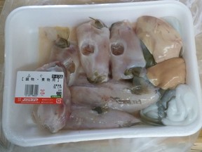 This Monday, Jan. 15, 2018, photo provided by Aichi Prefectural Government's Department of Health and Public Welfare shows a package containing potentially deadly liver, top right. A purchaser took it to the health centre in Nagoya, central Japan.