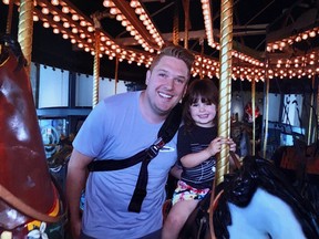 Three-year-old Joeli enjoys a ride on the Chinook Centre carousel. Her family learned Sunday that the carousel had been removed from the southwest mall's food court.