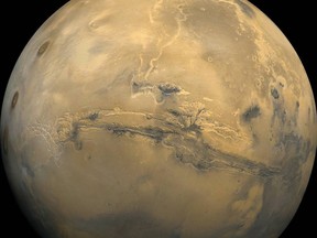 Planetary scientists say a new analysis of data shows that thick ice sheets hide just below parts of the surface of Mars.