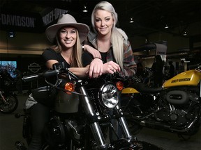 Lauren Reschke, left and Erin Woon of The Litas, an all women motorcycle collective, pose for a photo at the Calgary Motorcycle show on Friday January 5, 2018. Leah Hennel/Postmedia