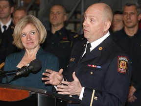 Alberta Premier Rachel Notley and Alberta Fire Fighters Association president Craig Macdonald speak to media at the Firefighters Training Academy in Calgary on Jan. 19, 2018.