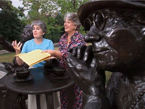 Jean-d'arc Sharpe (left) and Frances Wright, then-President and Ceo of the Famous 5 Foundation, petition for signatures to change the national anthem to include women at the Famous 5 monument on Parliament Hill on July 30, 2001.