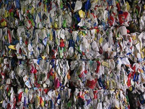 Recyclable materials compressed into large cubes are stacked at the Dufferin Waste Management facility in Toronto on Thursday, March 12, 2009. A Chinese ban on most foreign recycling material is leaving some Canadian municipalities with stockpiles of papers and plastics, much of which may eventually end up in the dump. The ban is also driving down the revenues cities make off their recyclables because the competition to find a company able to take the materials is stiff.THE CANADIAN PRESS/Darren Calabrese ORG XMIT: CPT135