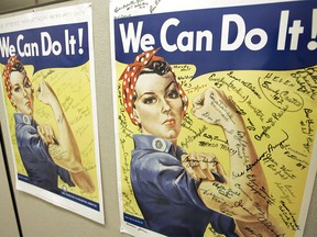 File - In this Oct. 31, 2007 file photo, a poster showing signatures of former Rosie the Riveter's is seen at the offices of the Rosie the Riveter/World War II Home Front National Historic Park in Richmond, Calif. A woman identified by a scholar as the inspiration for Rosie the Riveter, the iconic female World War II factory worker, has died in Washington state. The New York Times reports that Naomi Parker Fraley died Saturday, Jan. 20, 2018, in Longview. She was 96. Multiple women have been identified over the years as possible models for Rosie, but a Seton Hall University professor in 2016 focused on Fraley as the true inspiration. (AP Photo/Eric Risberg, File) ORG XMIT: FX104