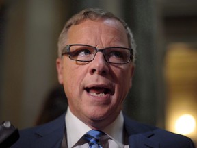 Premier Brad Wall speaks with members of the media following the 2017 budget speech at the Legislative Building in Regina Wednesday, March 22, 2017. One of the country's most consistently popular premiers will be replaced this weekend and observers say it will be a struggle for the successful candidate to fill their former boss's shoes.