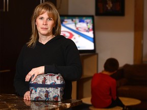 Mom, Roxanne Dunlop with her son Lochlan,7, is not happy after she found out the students at William Reid Elementary, a K-4 public school in Calgary have been watching Netflix cartoons at lunch in their classrooms, no longer able to socialize with friends in the gym as they were doing last year. on Thursday January 18, 2018. Darren Makowichuk/Postmedia