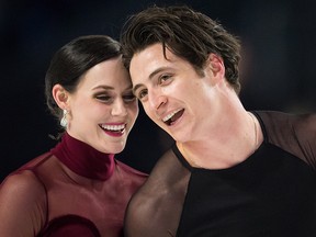 Tessa Virtue and Scott Moir skate off the ice after performing their free dance during the senior ice dance competition at the Canadian Figure Skating Championships in Vancouver, B.C., on Jan. 13, 2018.