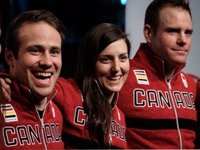 Kevin Drury, left, of Toronto, Ont., Kelsey Serwa, centre, of Kelowna, B.C., and Chris Del Bosco, of Montreal, Que., smile after being named to the Canadian Olympic ski cross team in Calgary, Alta., Monday, Jan. 22, 2018